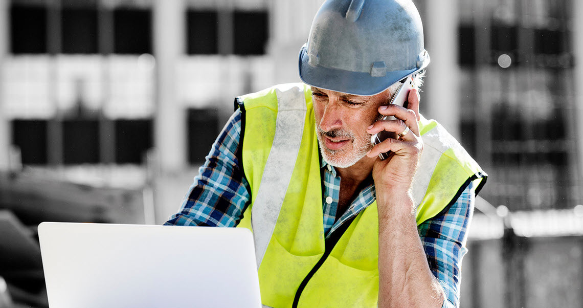 image of a male and female construction project  manager on site